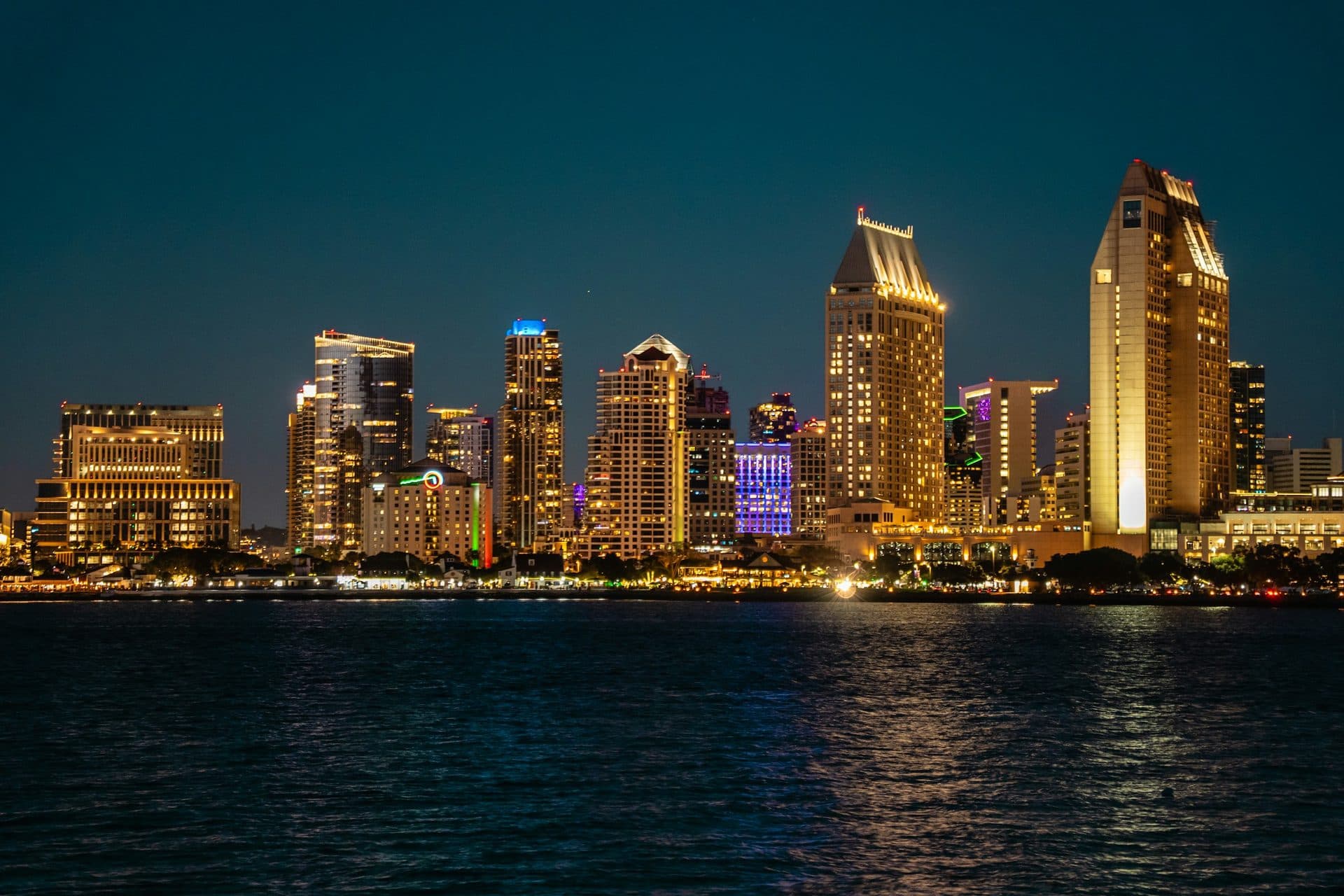 San Diego waterfront towers lit up at night across the bay